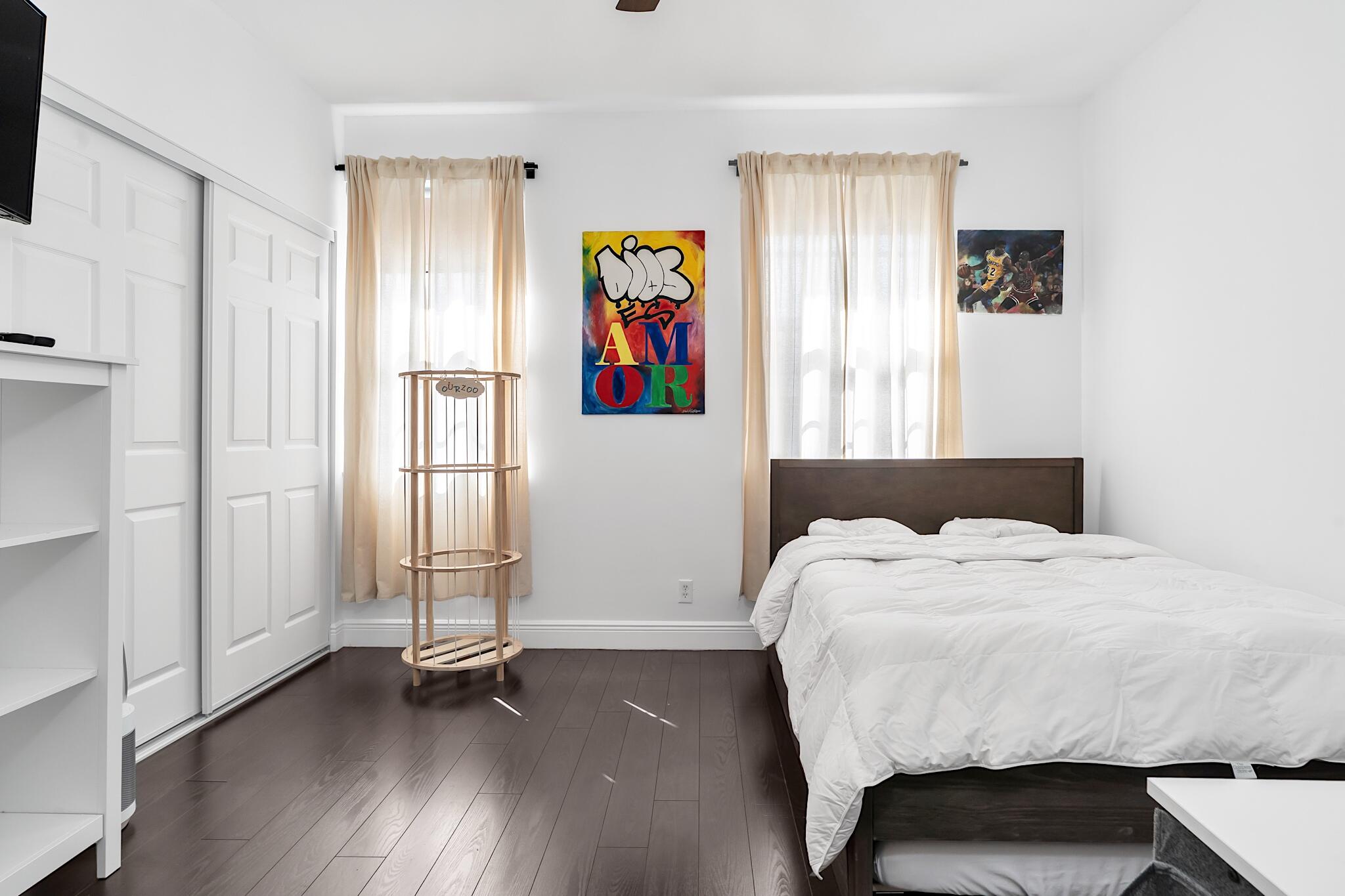 12 Fleming Court Weston, FL 33326 - Photo 30 of 51 a bed room with a bed and a table