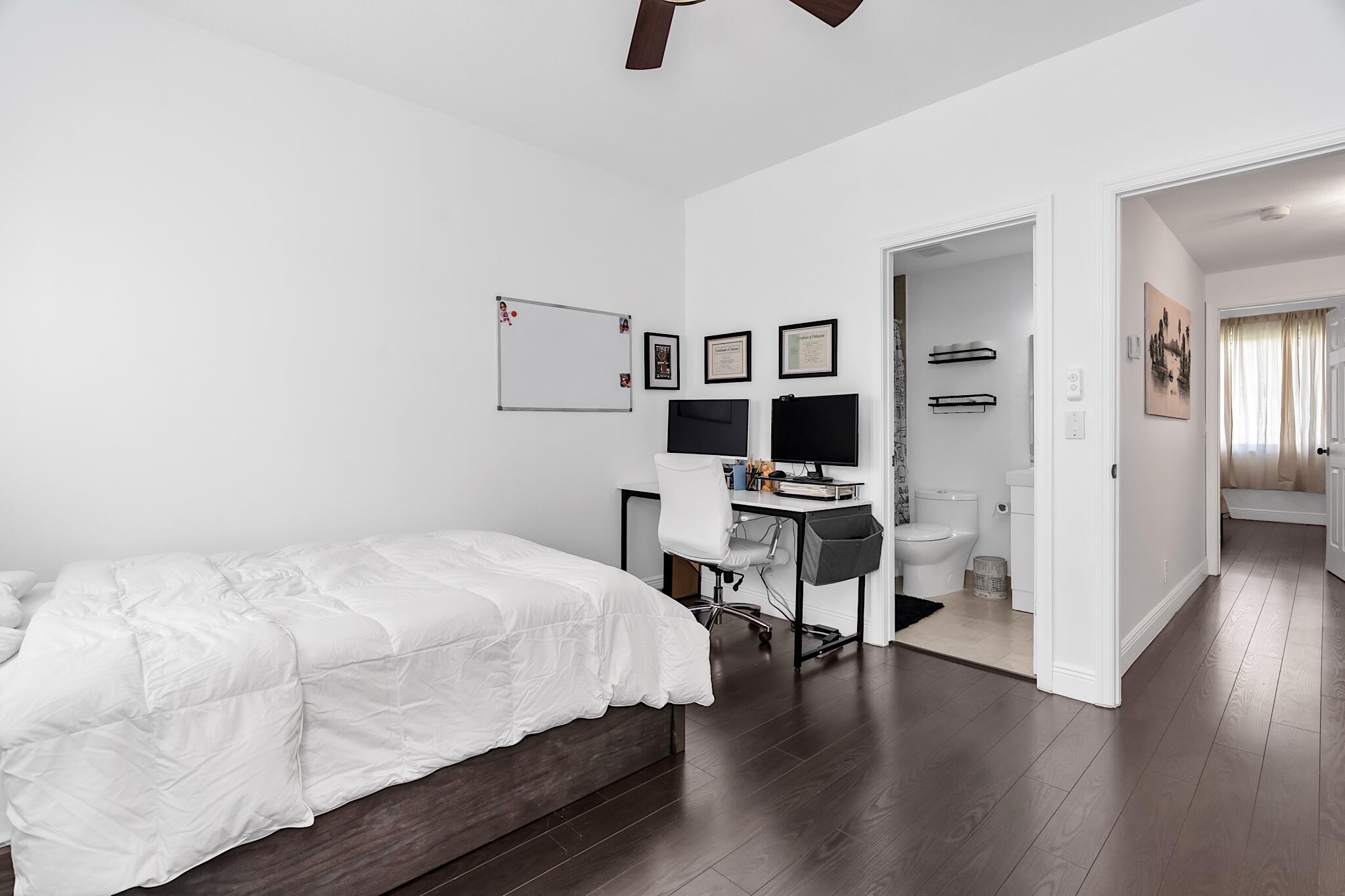 12 Fleming Court Weston, FL 33326 - Photo 31 of 51 a bedroom with a bed and a flat screen tv