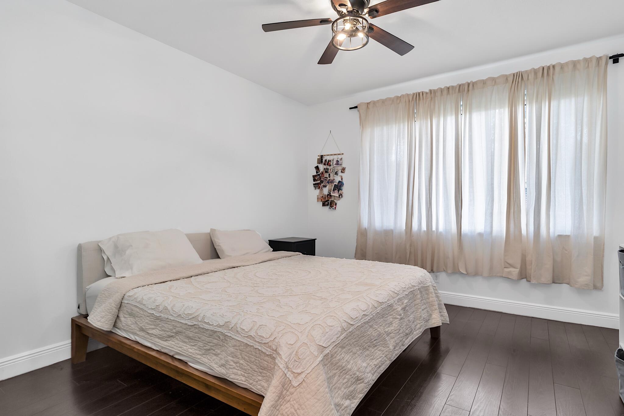 12 Fleming Court Weston, FL 33326 - Photo 34 of 51 a bedroom with a bed and a chandelier