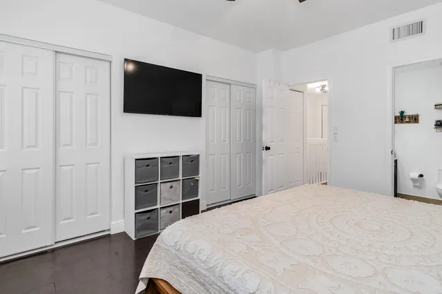 a bathroom with a sink mirror and vanity