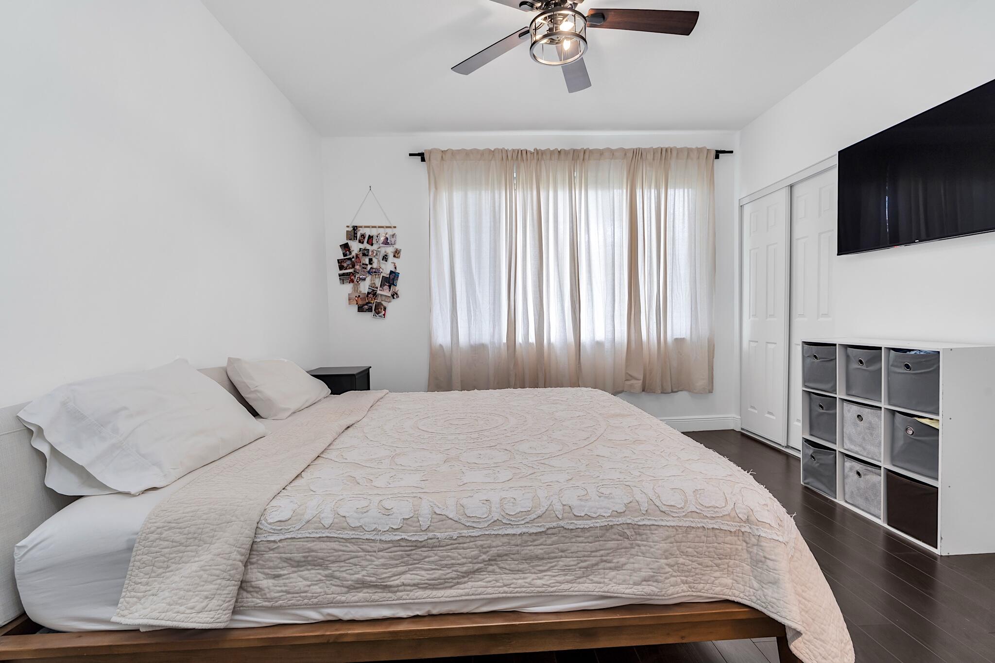 12 Fleming Court Weston, FL 33326 - Photo 40 of 51 a bedroom with a large bed and tv