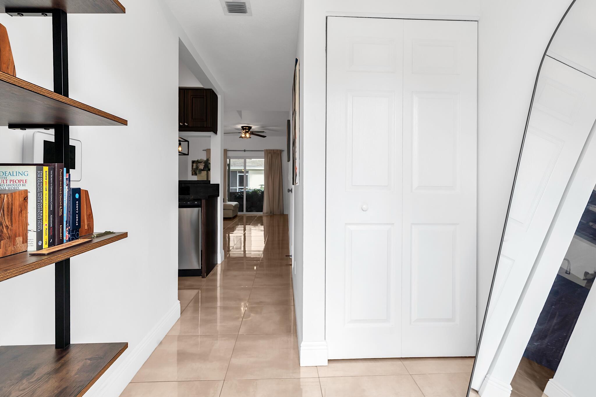 12 Fleming Court Weston, FL 33326 - Photo 4 of 51 a view of a hallway with the wooden floor and staircase
