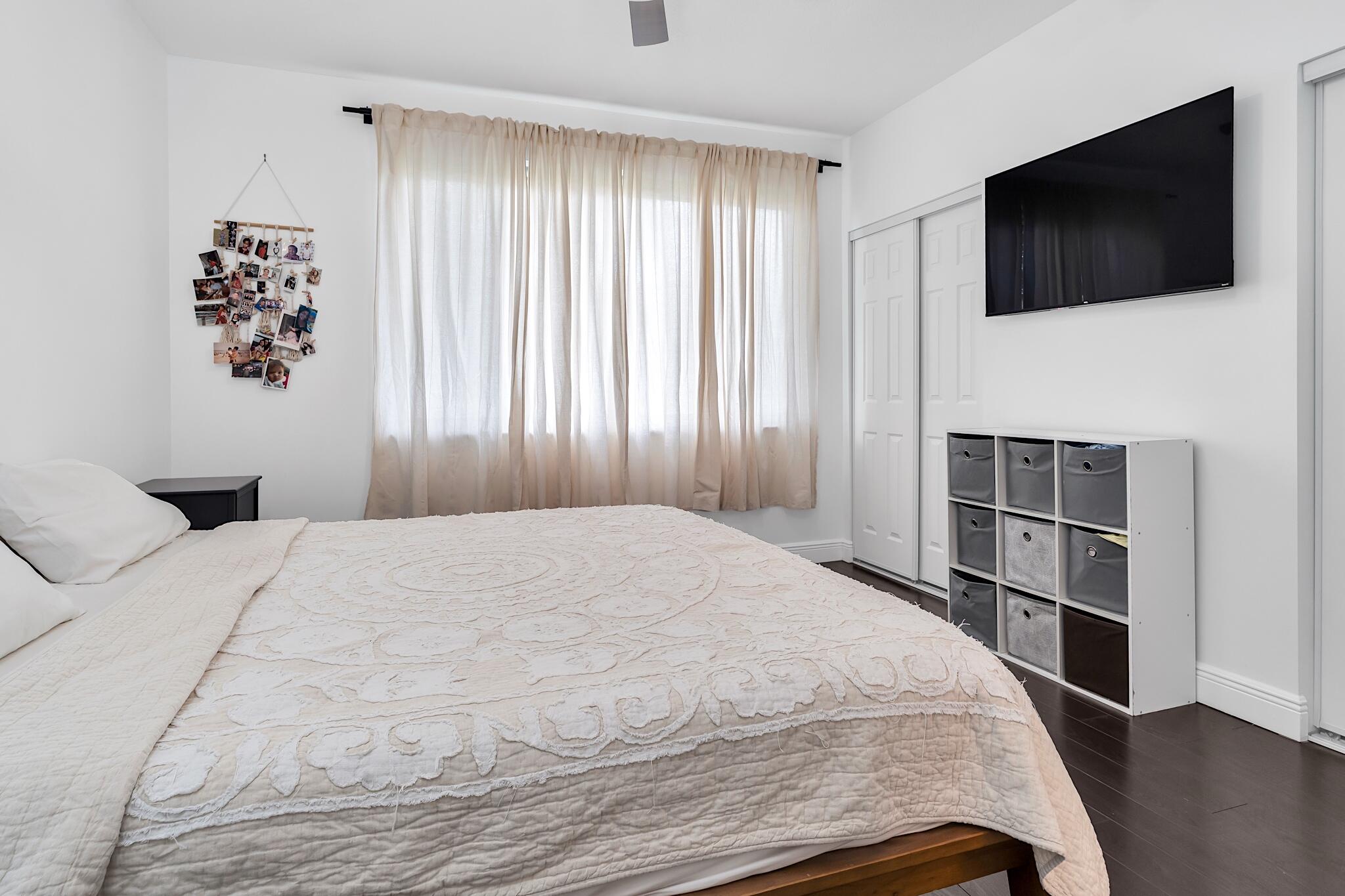 12 Fleming Court Weston, FL 33326 - Photo 41 of 51 a bedroom with a bed and a flat screen tv