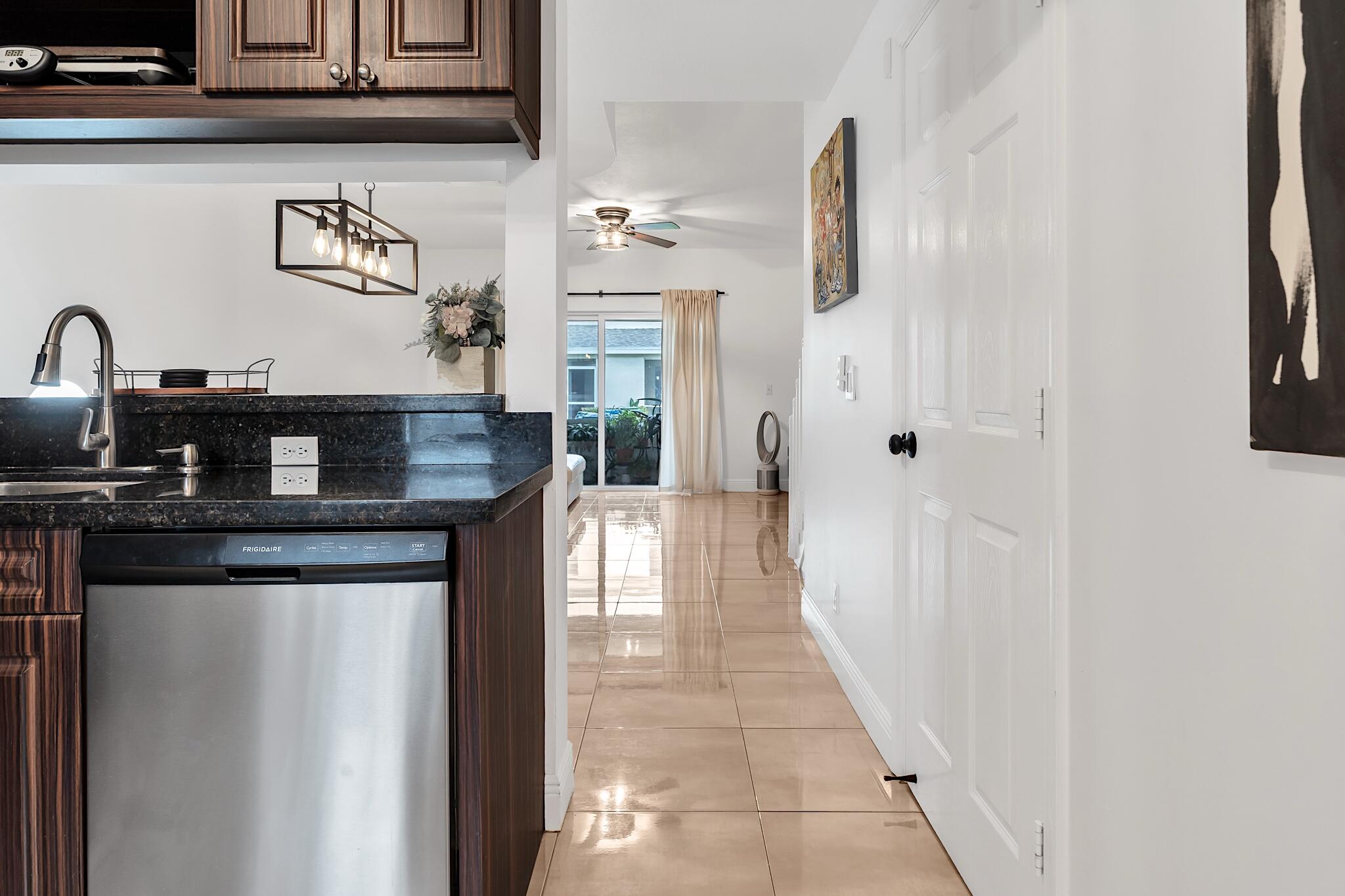 12 Fleming Court Weston, FL 33326 - Photo 8 of 51 a kitchen with stainless steel appliances granite countertop a refrigerator and a stove top oven