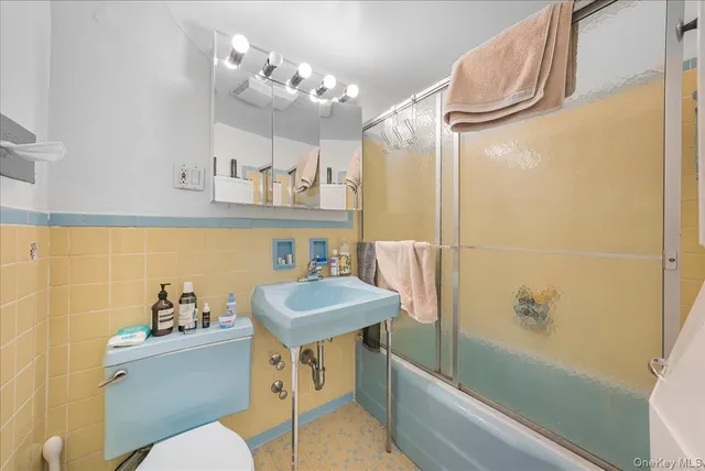 a view of a patio with a table and chairs and wooden floor