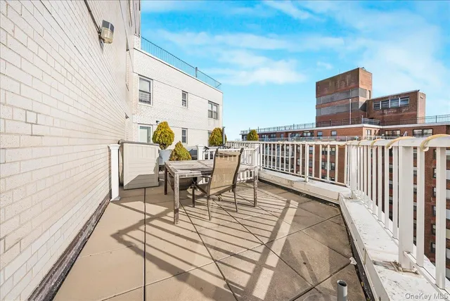 a view of roof deck with patio