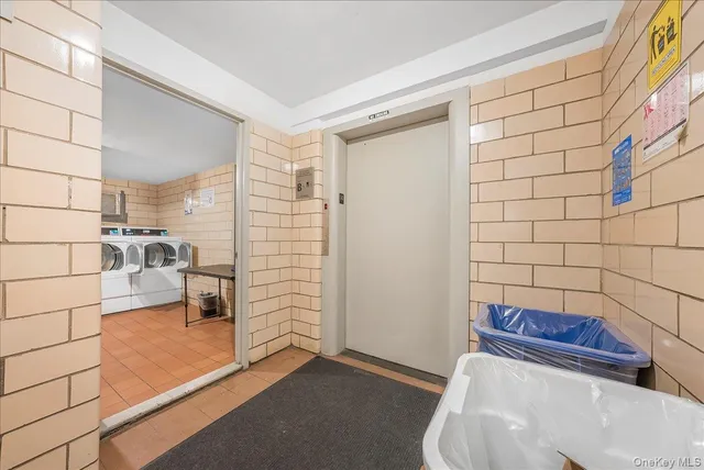 a room with lots of potted plants