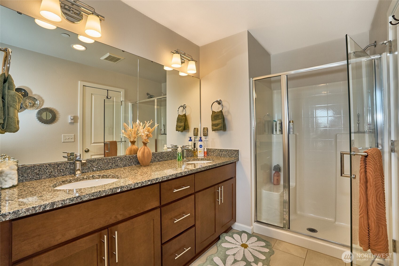 13146 83rd Lane South Seattle, WA 98178 - Photo 19 of 22 a bathroom with a granite countertop sink mirror and shower