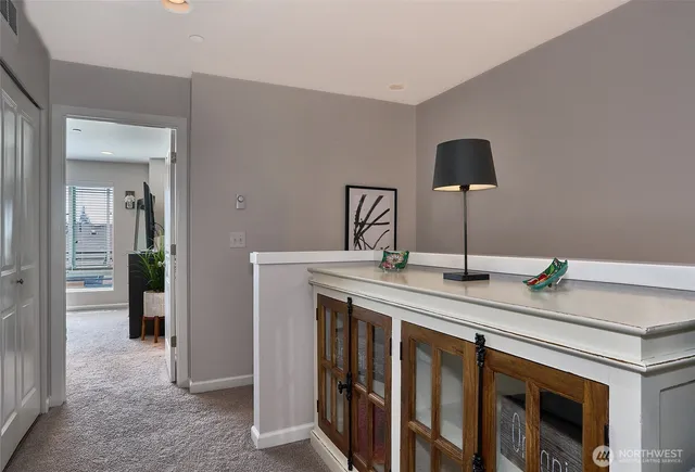 a kitchen with stainless steel appliances granite countertop a sink and a refrigerator