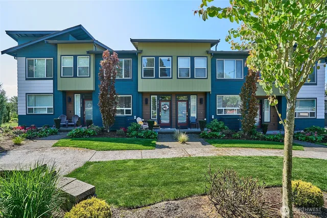 a front view of a house with a yard and porch