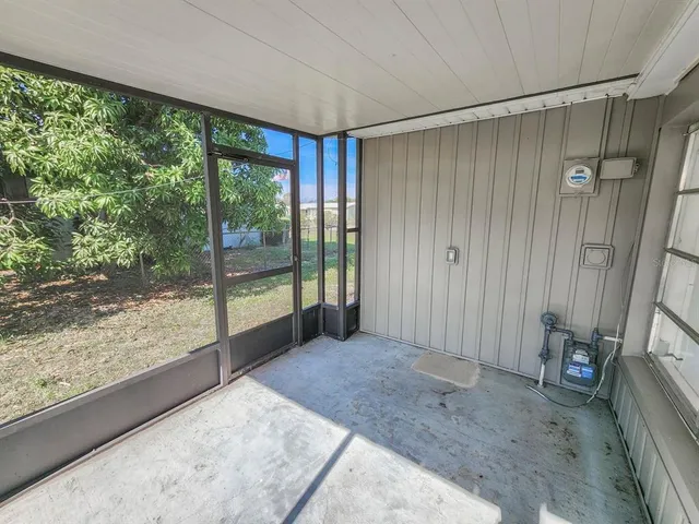 a view of a room with large windows