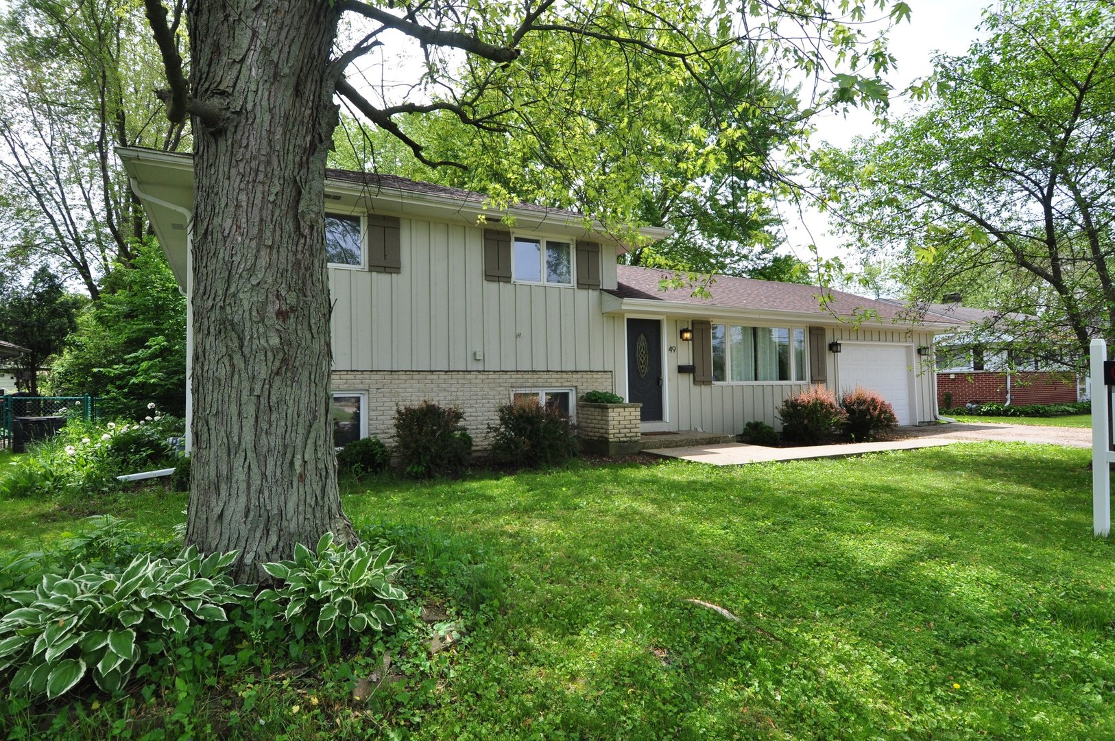 49 Miller Road Lake Zurich, IL 60047 - Photo 1 of 19 a front view of house with yard and green space