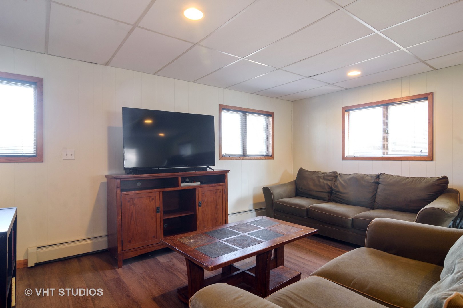 49 Miller Road Lake Zurich, IL 60047 - Photo 11 of 19 a living room with furniture and a flat screen tv