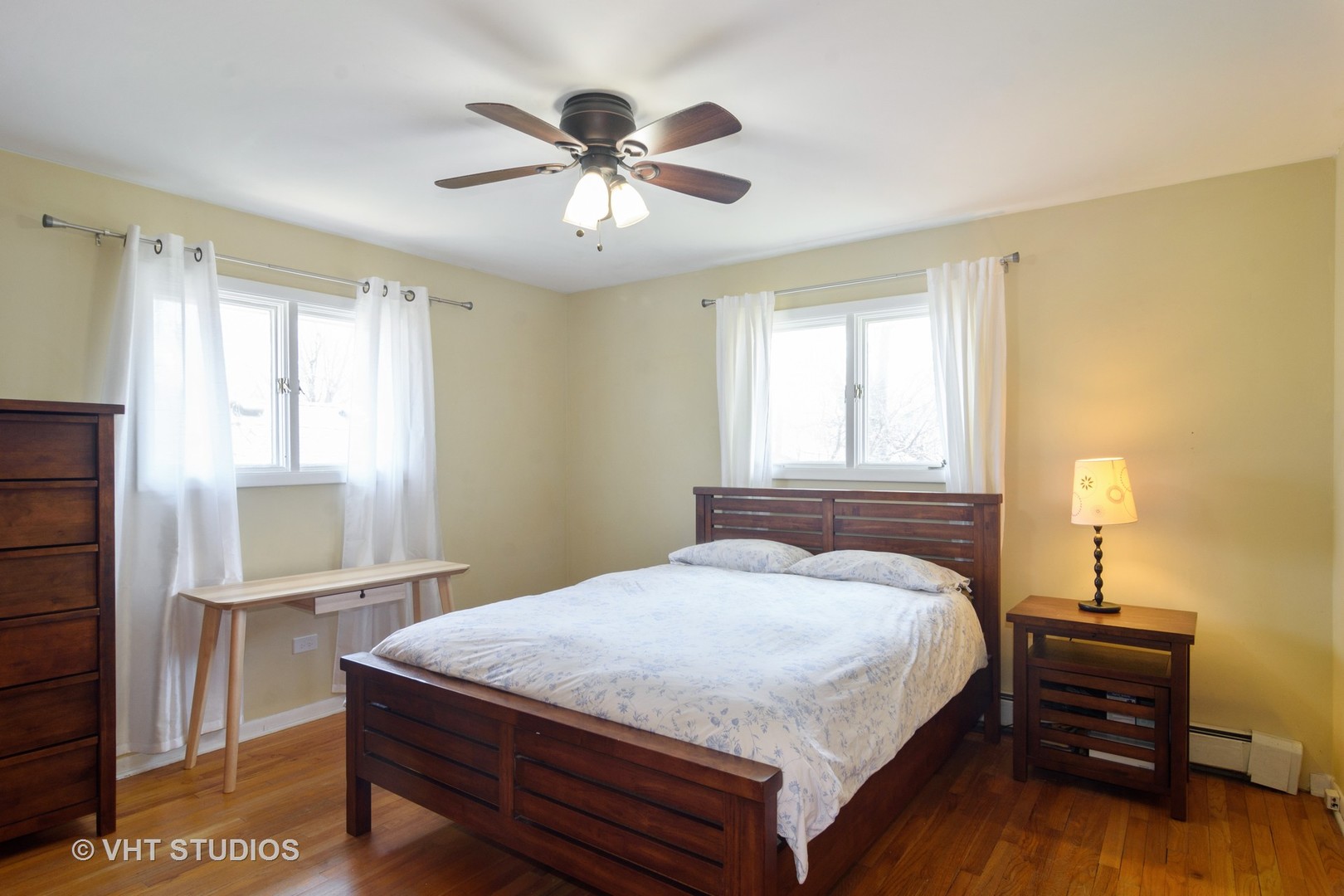 49 Miller Road Lake Zurich, IL 60047 - Photo 12 of 19 a bedroom with a bed and a lamp on dresser