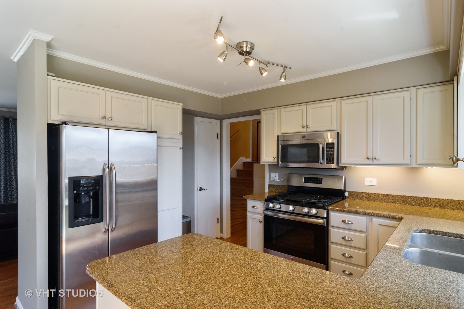 49 Miller Road Lake Zurich, IL 60047 - Photo 7 of 19 a kitchen with stainless steel appliances granite countertop a stove refrigerator and microwave