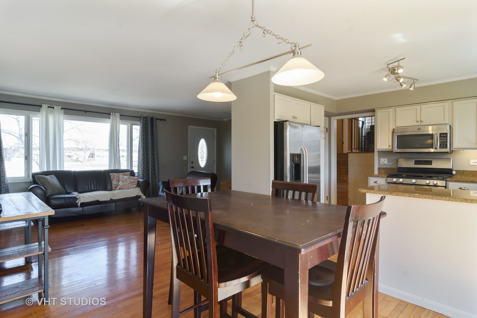 49 Miller Road Lake Zurich, IL 60047 - Photo 9 of 19 a view of a dining room with furniture window and wooden floor