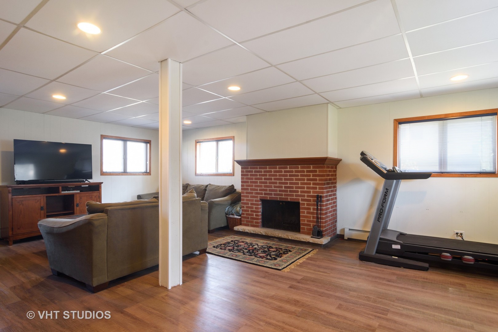 49 Miller Road Lake Zurich, IL 60047 - Photo 10 of 19 a living room with furniture and a flat screen tv
