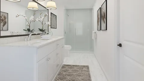 a bathroom with a sink a toilet and mirror