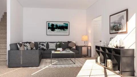 a living room with furniture and painting on the wall