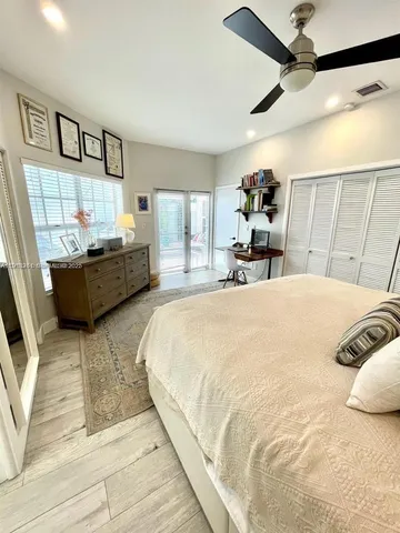 a bedroom with a bed and a sink