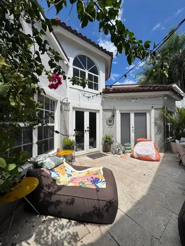 a view of a table and chairs in the garden