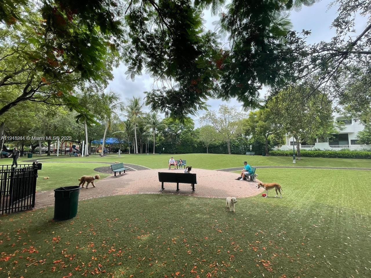 3070 Allamanda Street, Unit J Miami, FL 33133 - Photo 22 of 22 a view of a table and chairs in the garden