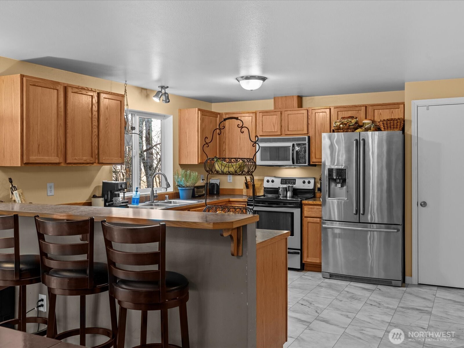 218-38 Bowen Road Mossyrock, WA 98564 - Photo 12 of 40 a kitchen with stainless steel appliances granite countertop a refrigerator and a stove top oven