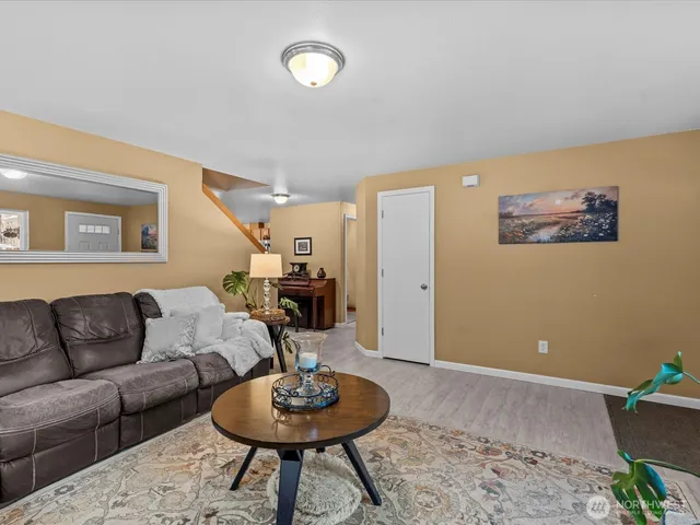 a large kitchen with a sink and cabinets