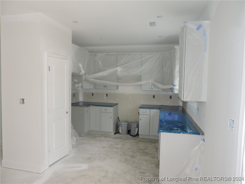 360 Summerhill Road Fayetteville, NC 28303 - Photo 4 of 9 a view of a kitchen with a sink and dishwasher