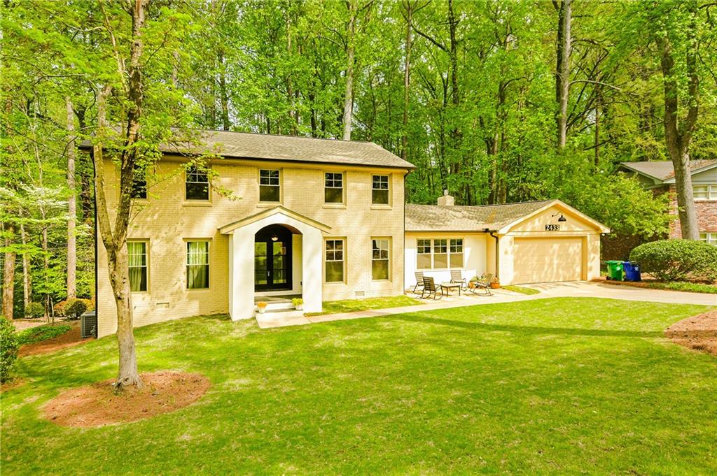 a front view of a house with a yard