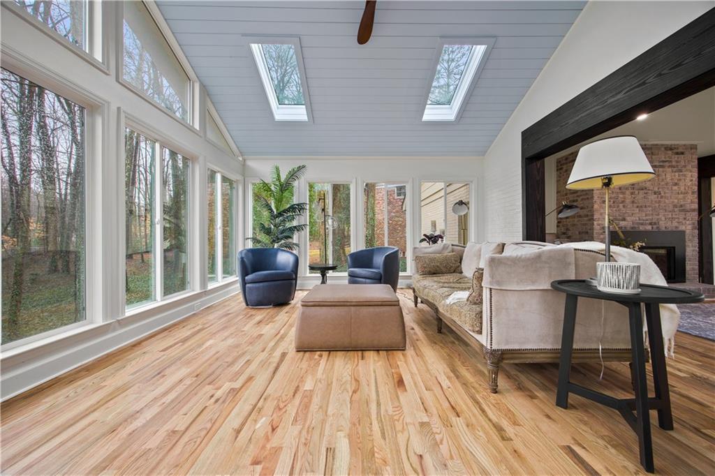 2433 Helmsdale Drive Northeast Atlanta, GA 30345 - Photo 14 of 42 a living room with furniture and a wooden floor