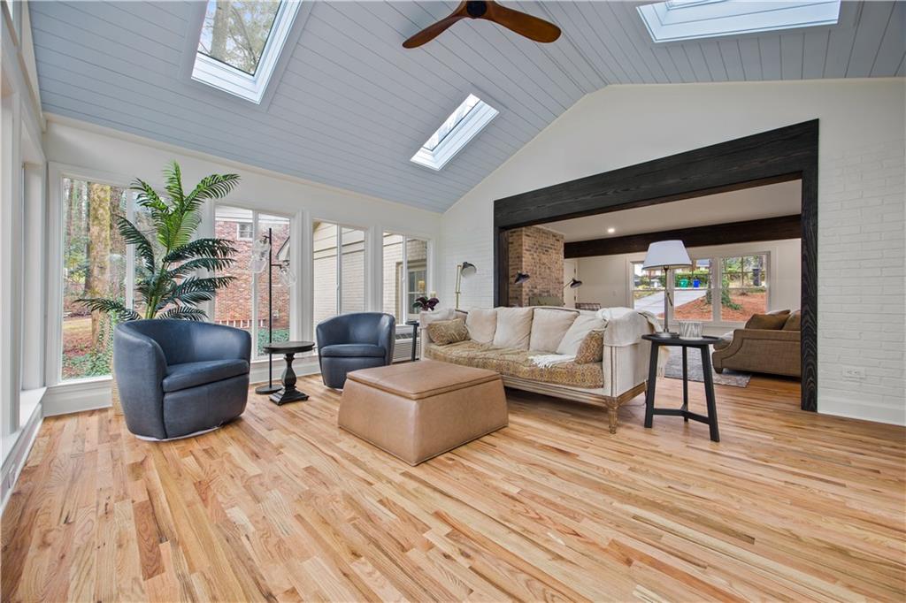 2433 Helmsdale Drive Northeast Atlanta, GA 30345 - Photo 15 of 42 a living room with furniture and a wooden floor
