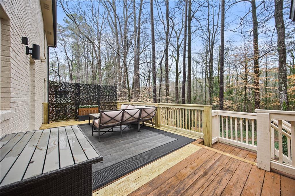 2433 Helmsdale Drive Northeast Atlanta, GA 30345 - Photo 16 of 42 a view of a deck with couches and wooden floor