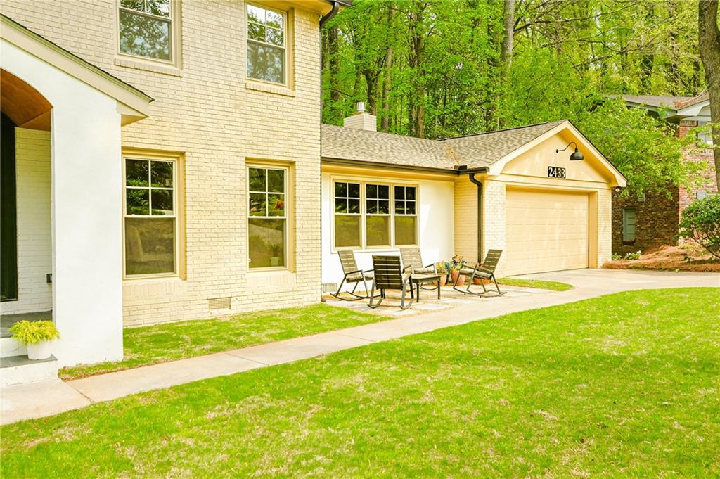 2433 Helmsdale Drive Northeast Atlanta, GA 30345 - Photo 2 of 42 a front view of house with yard and outdoor seating