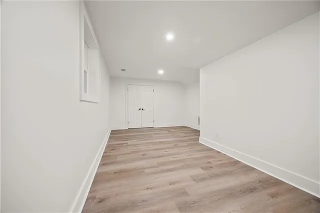 a bathroom with a granite countertop sink a toilet and shower