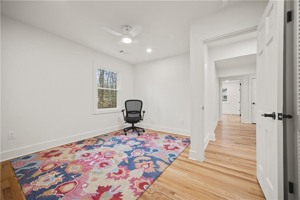 2433 Helmsdale Drive Northeast Atlanta, GA 30345 - Photo 31 of 42 a view of a bedroom with wooden floor and bathroom