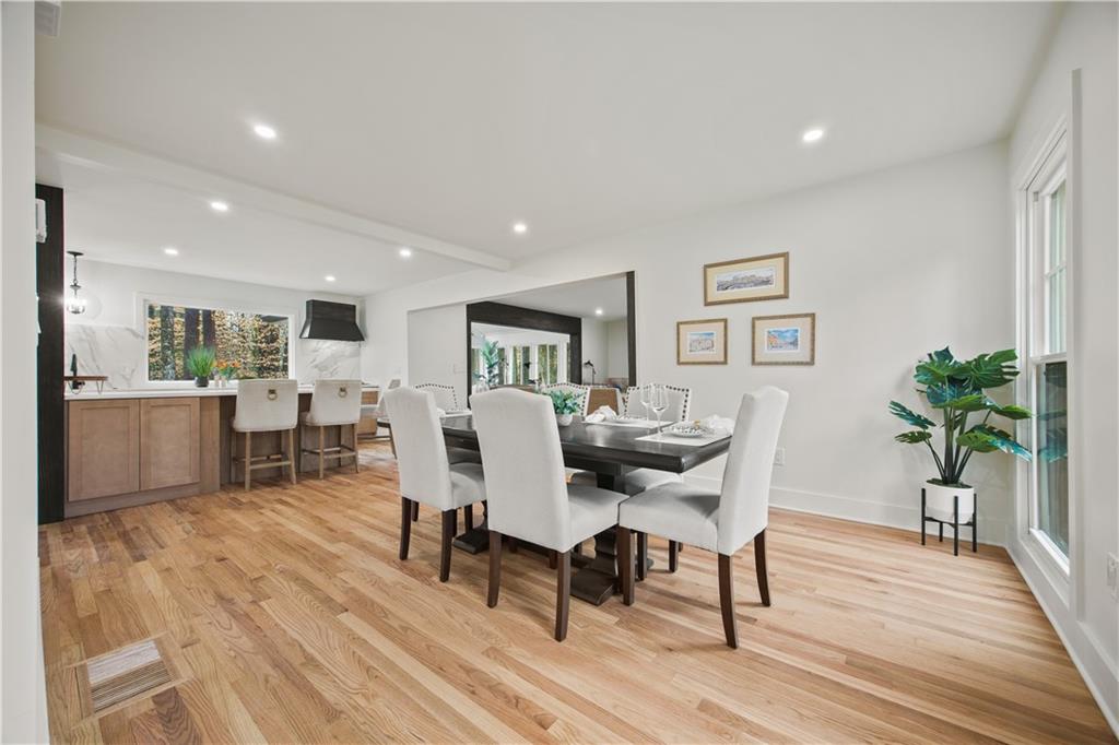 2433 Helmsdale Drive Northeast Atlanta, GA 30345 - Photo 33 of 42 a view of a dining room with furniture and wooden floor