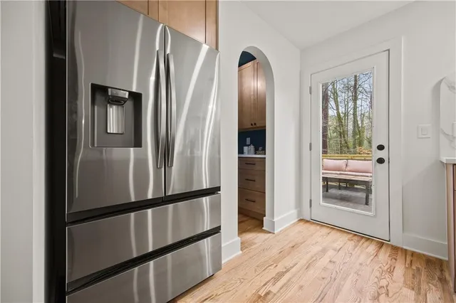 a kitchen with sink a stove and cabinets
