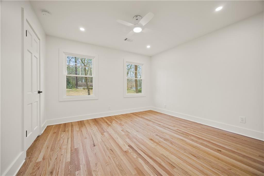 2433 Helmsdale Drive Northeast Atlanta, GA 30345 - Photo 42 of 42 wooden floor in an empty room with a window