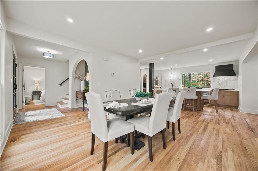 2433 Helmsdale Drive Northeast Atlanta, GA 30345 - Photo 7 of 42 a dining room with furniture and wooden floor