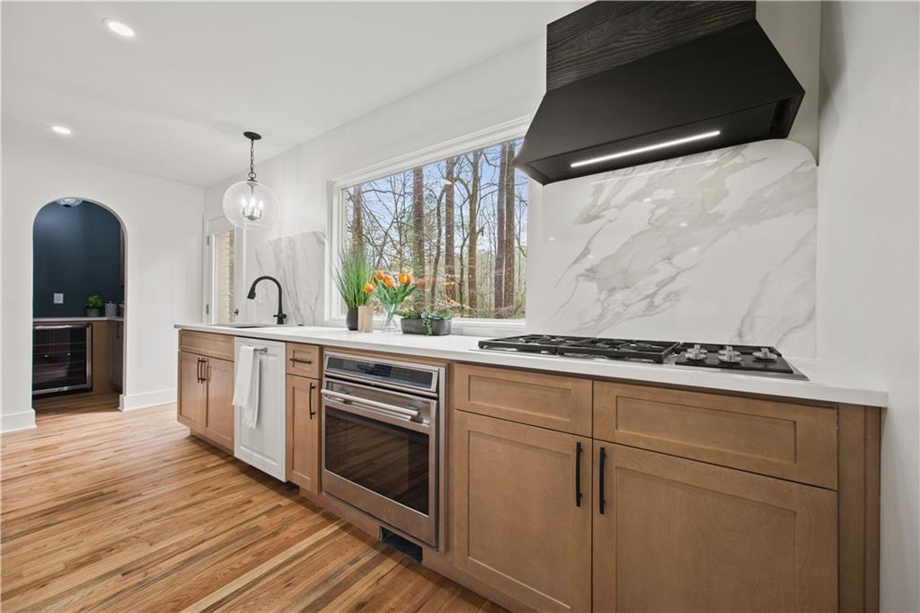 2433 Helmsdale Drive Northeast Atlanta, GA 30345 - Photo 9 of 42 a kitchen with a stove a sink and a refrigerator