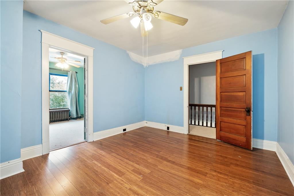 514 Park Road Ambridge, PA 15003 - Photo 14 of 25 wooden floor in an empty room with a window