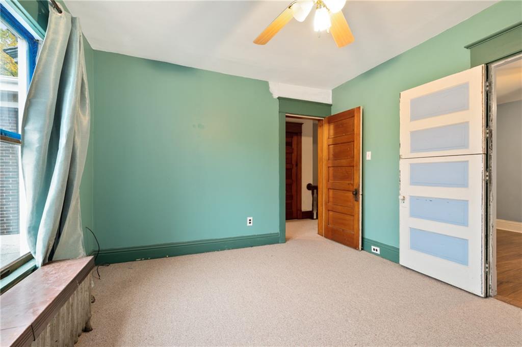 514 Park Road Ambridge, PA 15003 - Photo 18 of 25 a view of an empty room with window and stairs