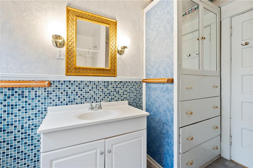 514 Park Road Ambridge, PA 15003 - Photo 21 of 25 a bathroom with a sink and a mirror