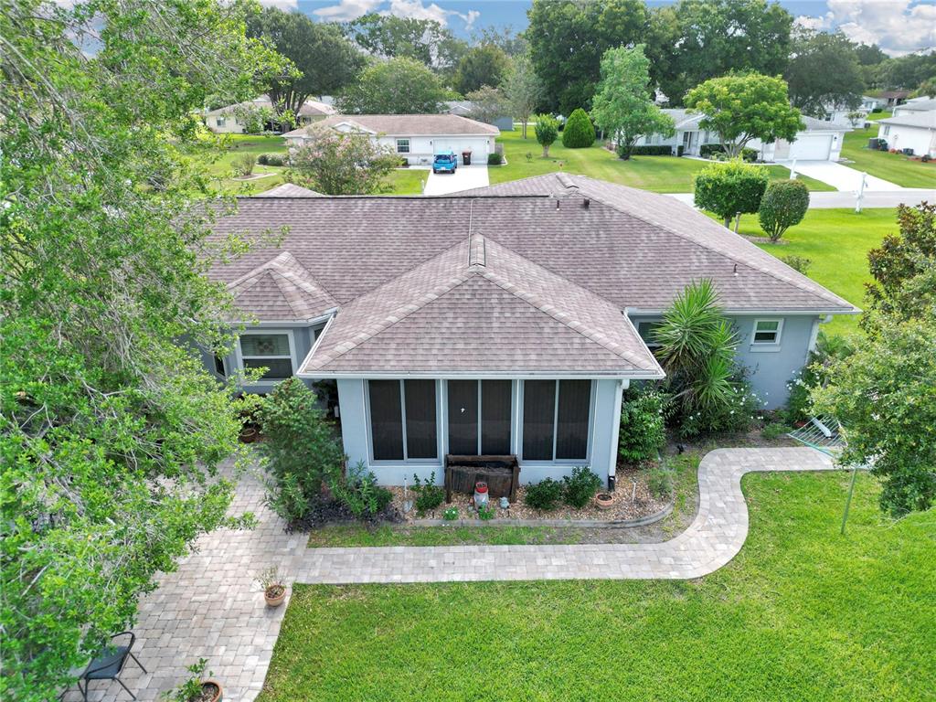 10086 Southwest 62nd Ter Road Ocala, FL 34476 - Photo 29 of 40 a aerial view of a house with a yard table and chairs