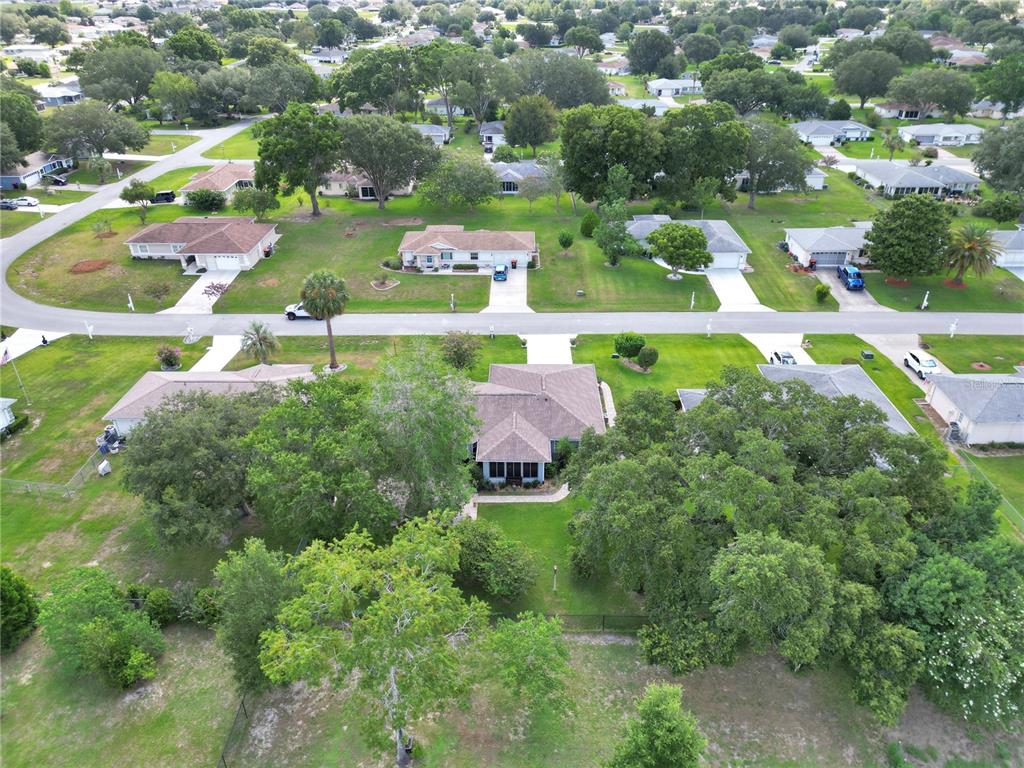 10086 Southwest 62nd Ter Road Ocala, FL 34476 - Photo 34 of 40 an aerial view of residential houses with outdoor space and street view