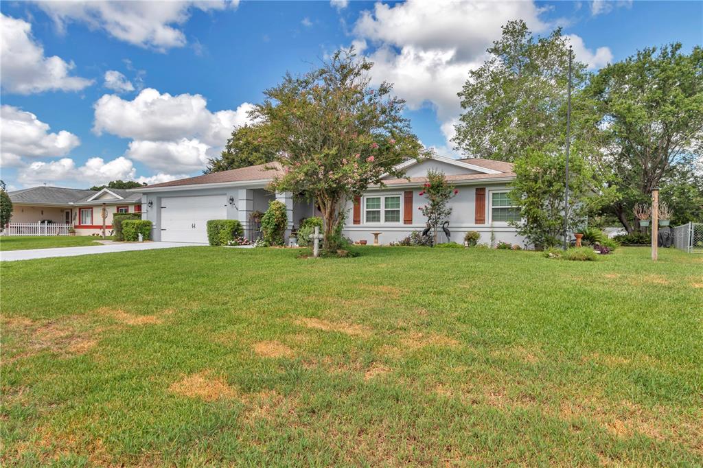 10086 Southwest 62nd Ter Road Ocala, FL 34476 - Photo 38 of 40 a view of a house with a yard