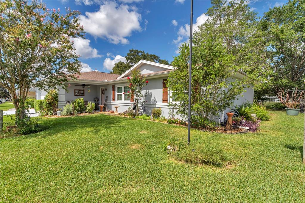 10086 Southwest 62nd Ter Road Ocala, FL 34476 - Photo 39 of 40 a view of a house with a big yard plants and large trees