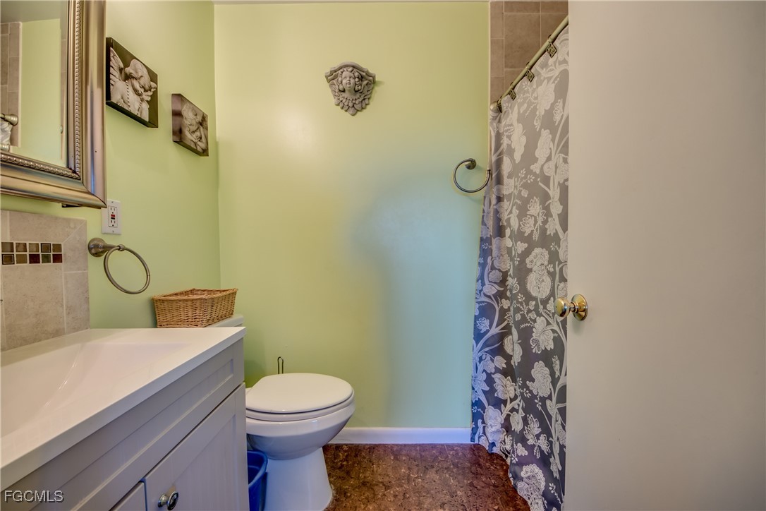 3315 Franzone Road St. James City, FL 33956 - Photo 15 of 37 a bathroom with a toilet sink and shower