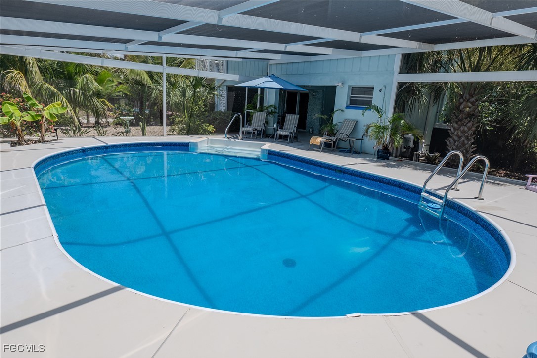 3315 Franzone Road St. James City, FL 33956 - Photo 20 of 37 a view of a swimming pool with an outdoor seating
